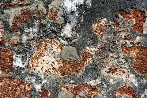 Old worn eroded stained brick concrete wall, with beautiful pattern and texture Photos