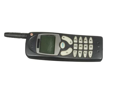 Old worn mobile phone outdated design isolated on white background. Mobile co Stock Photos