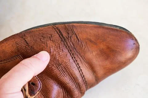 Old Worn Out Men Leather Shoes with Defects, Broken Heel and Sole, Showcasing Stock Photos