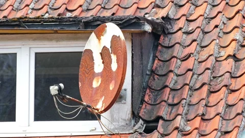 Old Worn Out Scratched Rusty Television Satellite Antenna Dish Installed on Roof Stock Footage 186695983