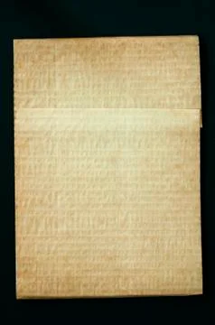 Old worn paper folded Stock Photos