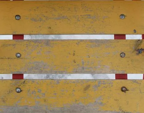 Old worn planks painted with yellow paint Stock Photos