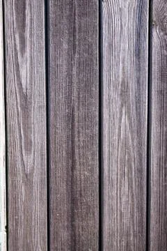 Old worn wall, natural gray planks in natural cracks and reliefs Foto stock