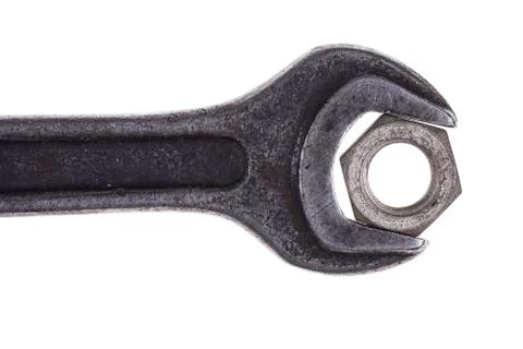 Old wrenches and nut closeup isolated on white background Stock Photos