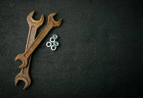 Old wrenches, chrome nuts, on background, retro tool, rusty metal Stock Photos