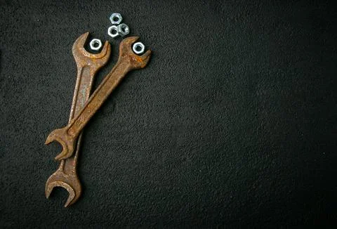 Old wrenches, chrome nuts, on background, retro tool, rusty metal Stock Photos