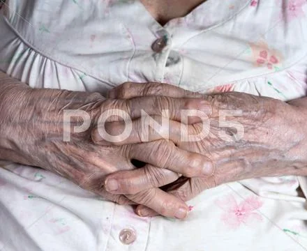 Old wrinkled woman's hands Stock Photos