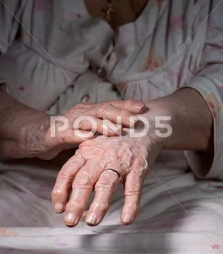 Old wrinkled woman's hands Stock Photos
