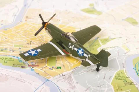 Old WWII model plane placed on the city map Stock Photos