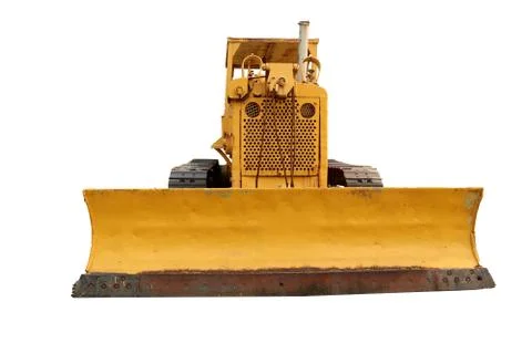 Old yellow rusty crawler tractor in the field. Old crawler tractor .isolated  Stock Photos