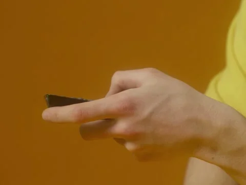 Old yellow TV with noises on the screen on a yellow background Stock Footage 229767874