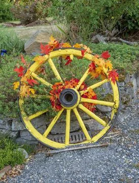 Old yellow wheel decorated Gresham Oregon. Stock Photos