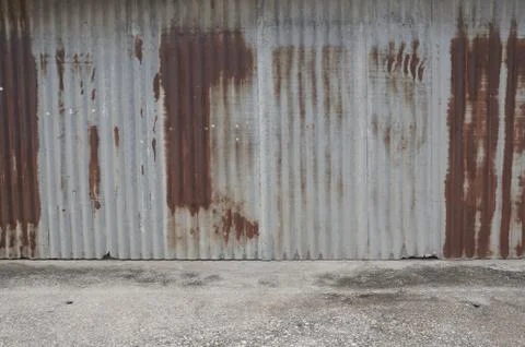 Old zing wall,background of peeling paint and rusty old metal.zinc wall textu Stock Photos
