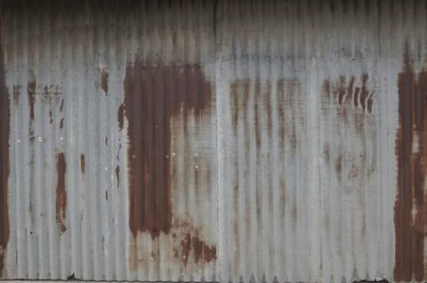 Old zing wall,background of peeling paint and rusty old metal.zinc wall textu Stock Photos