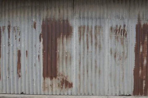 Old zing wall,background of peeling paint and rusty old metal.zinc wall textu Stock Photos