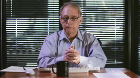A older businessman using his computer while talking over a video chat Stock Footage 33841388