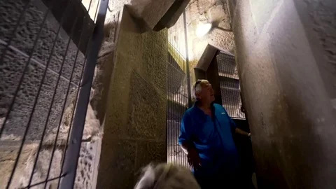 An Older Couple Comes Down a Winding Stair Case Stock Footage 83397074