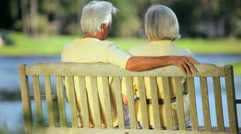 Older Couple on Park Bench Enjoying the View Stock Footage
