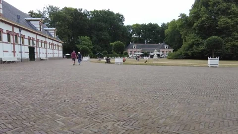 Older couple walking in Het Loo Palace, Netherlands August 15 2022 Stock Footage 296800393