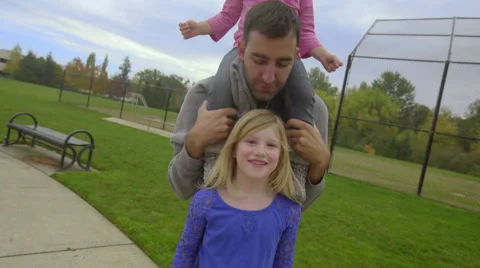 Older daughter smiles for the camera Stock Footage 58612401
