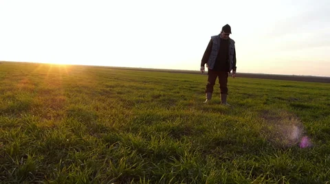 Older farmer checking on grain fields in early winter Stock Footage 49098109