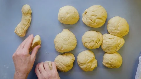 Older Female Baker Rolls Bread Dough in a Rustic Farmhouse Kitchen in 4k Stock Footage 87718851