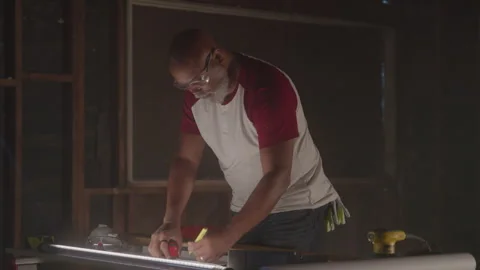 Older Guy Works Measuring On Table In Workshop Stock Footage 270390611