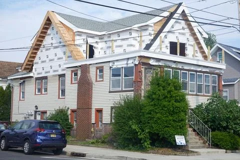An older home in the process of having a second floor addition constructed Stock Photos