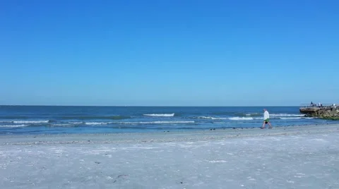 Older man on beach looking for shells 스톡 동영상 52672069