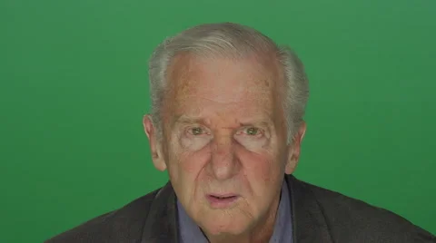 Older man confusingly staring, on a green screen background Stock Footage 66841886