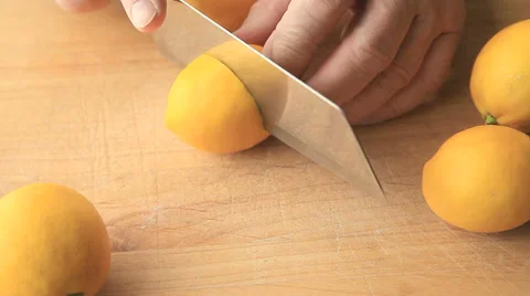 Older man cutting up lemons 스톡 동영상 62864123