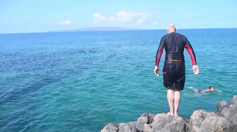 Older Man Diving in Ocean Stock Footage 24105219