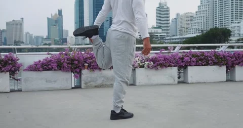 Older man doing pre-exercise routine warming up muscles dynamic stretches Stock Footage 275008650