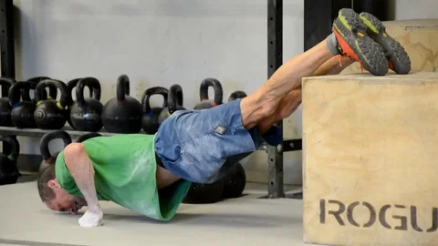 Older man doing pushups with elevated feet. Stock-Footage 71446078