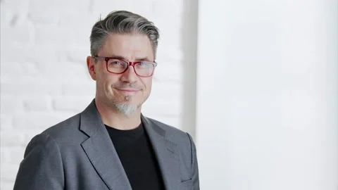 Older man in glasses looking at camera and smiling Stock Footage 132920202