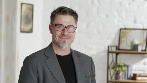 Older man in glasses looking at camera and smiling 스톡 동영상 143114455