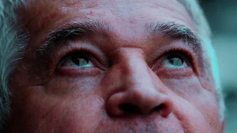 Older man looking up at sky close-up face, 70s senior person turns head upw.. Stock Footage 267607157