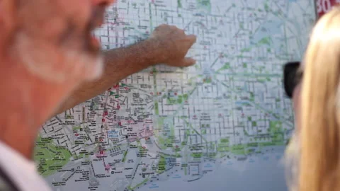 Older man pointing at tourist map of Barcelona, Spain Stock Footage 143346178