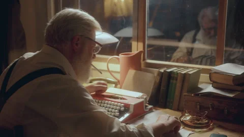 Older Man Smoking, Taking Notes and Working on Typewriter at Desk Stock Footage 285143414
