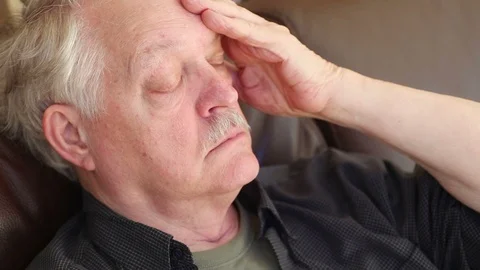 Older man on sofa has headache Stock-Footage 88961530