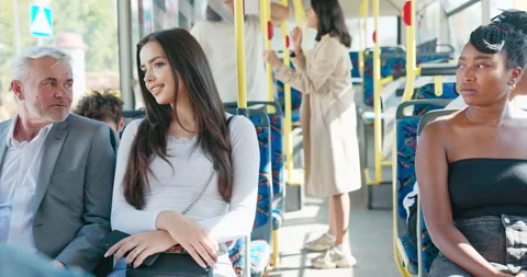 Older man in suit returns from work by bus, guy sits next to beautiful Vídeo Stock 174540725