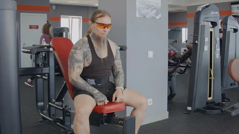 An older man is training on multi press machine. Stock Footage 115429837