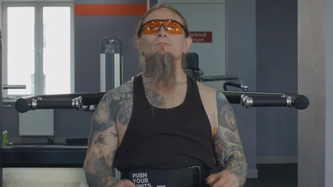 An older man is training on multi press machine. Stock Footage 115430050