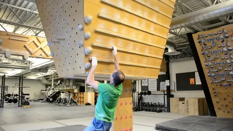 Older man training for rock climbing on a campus board  Stock-Footage 71446702