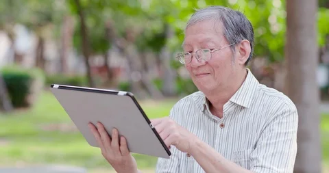 Older man use tablet Stock Footage 108734262