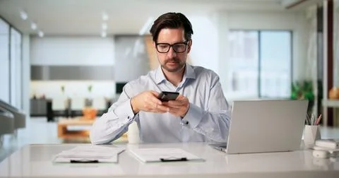 Older Man Uses Smartphone To Quickly Capture Clear Photo Of Invoice Document. Stock Photos