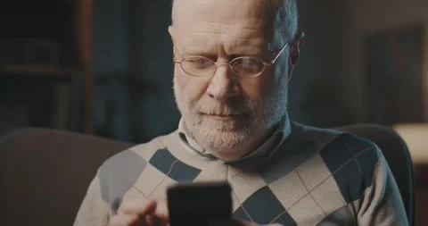 Older man using a smartphone Stock Footage 297846330