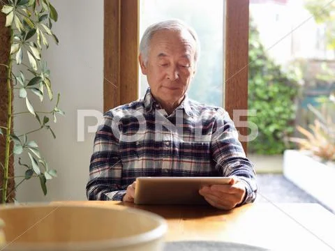 Older Man Using Tablet Computer