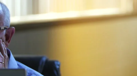 Older man very upset while working at computer Stock Footage 54568466