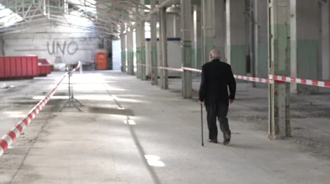 Older man walking in old building Stock Footage 37012767